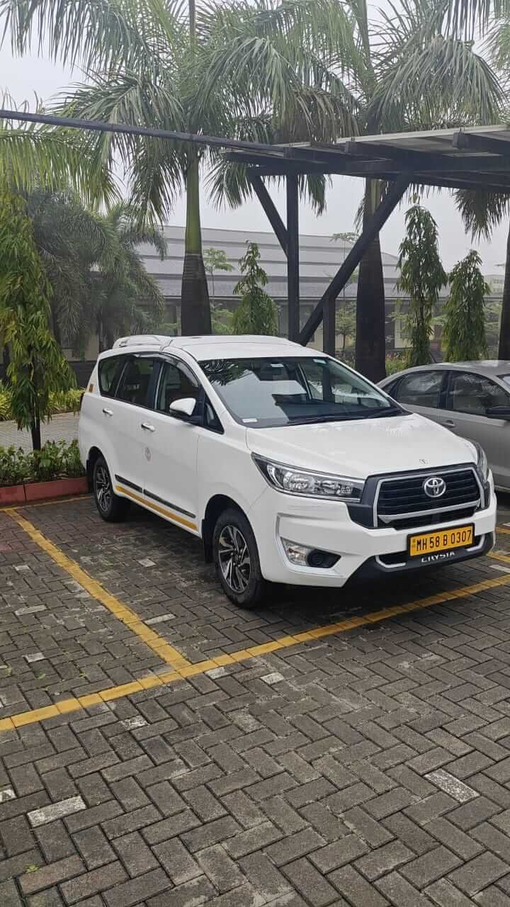 Chauffeur opening car door for a client